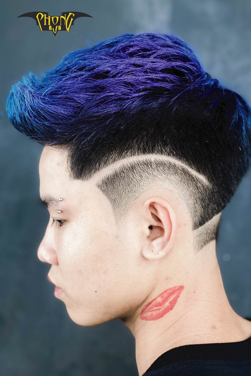Kỹ thuật cắt Skin Fade mượt mà trên tóc nam, tạo hiệu ứng mờ dần ấn tượng.