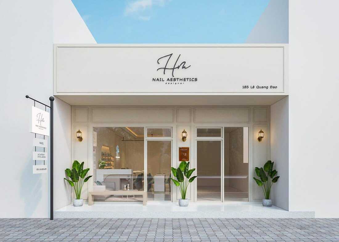 Mặt tiền spa tối giản với tường màu kem và cửa kính lớn