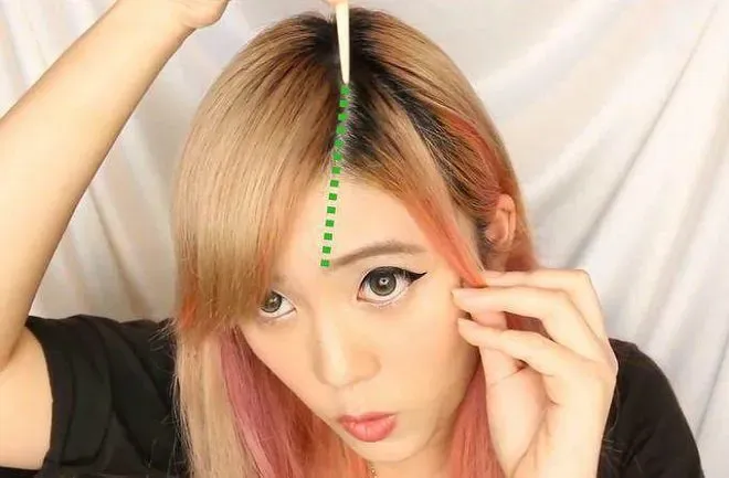 Cô gái với mái xéo dài được cắt tỉa kỹ thuật ôm sát gương mặt, tạo cảm giác mềm mại