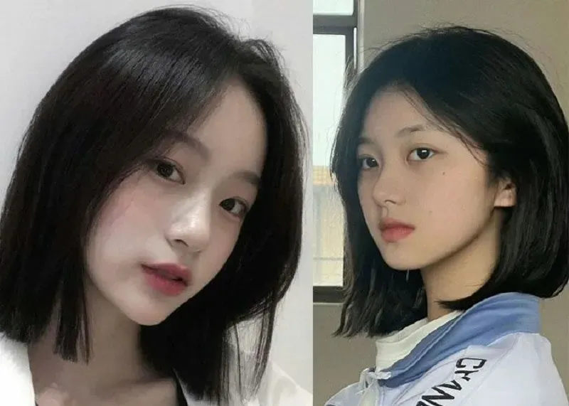 Người mẫu có tóc ngang vai búi nửa đầu đơn giản, tôn lên gương mặt tròn thanh thoát