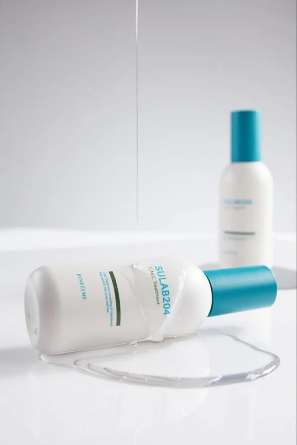 Chai dầu gội C.M.C TREATMENT DETOX DA ĐẦU màu xanh lá và trắng