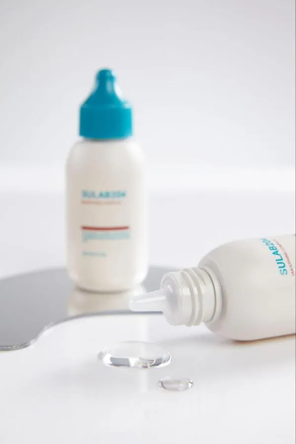 Chai dầu xả SMOOTHING COMPLEX PHỤC HỒI CẤU TRÚC TÓC màu trắng và xanh dương