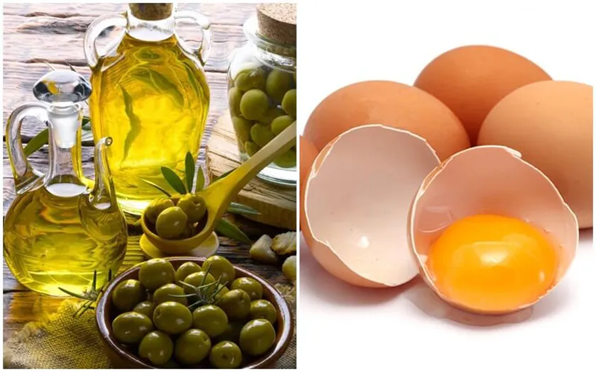 Hình ảnh một người đang thoa hỗn hợp mặt nạ dưỡng ẩm sâu từ trứng gà và dầu ô liu lên mái tóc