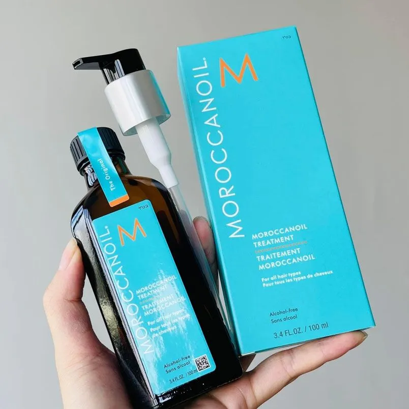 Một lọ serum hoặc dầu dưỡng tóc cao cấp, tượng trưng cho liệu pháp chăm sóc tóc chuyên sâu