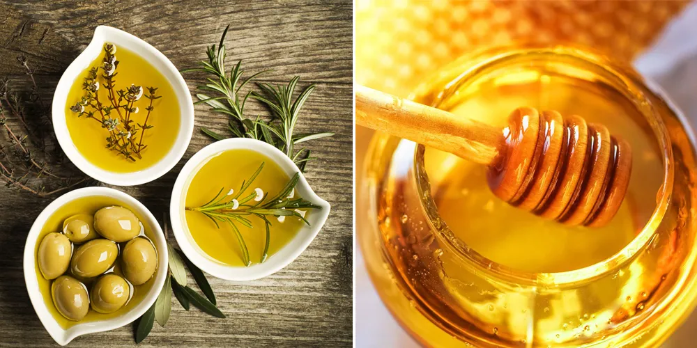 Mô tả chi tiết: Hình ảnh chai dầu ô liu và một ít mật ong, hai nguyên liệu tự nhiên có tác dụng dưỡng ẩm và làm mượt tóc hiệu quả