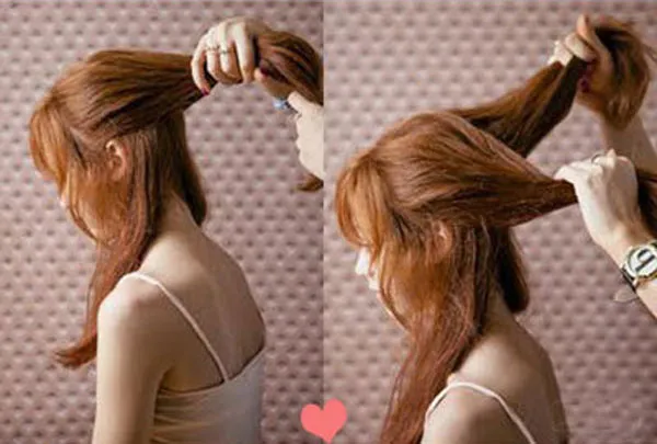 Phân chia tóc thành hai nửa để chuẩn bị làm tóc hình trái tim