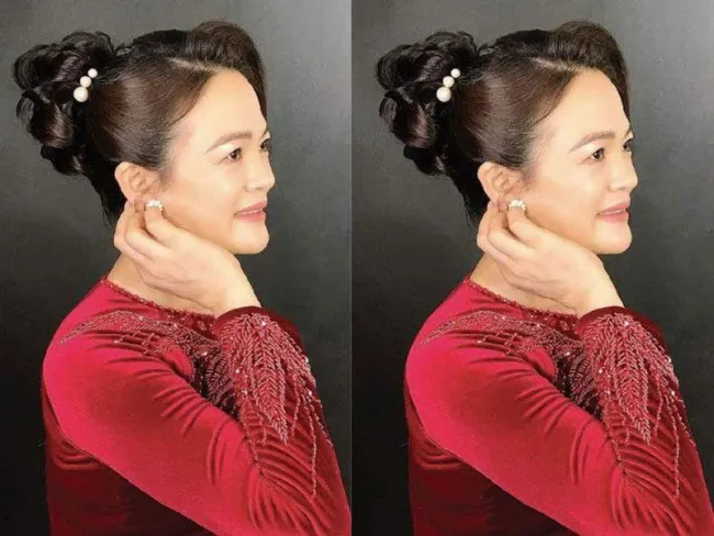 Kiểu búi tóc cao quý phái, tạo độ phồng tối đa ở đỉnh đầu, phù hợp với mẹ cô dâu muốn vẻ ngoài trẻ trung