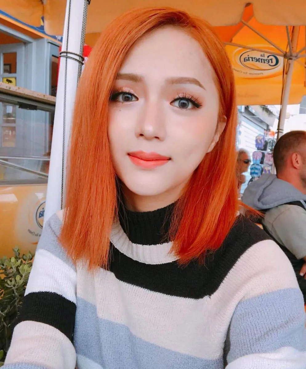 Nhuộm Tóc Màu Đỏ Cam: Phân tích tông da và lựa chọn sắc độ chuẩn