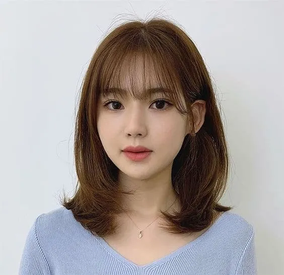 Tóc mái bay layer Hàn Quốc cho mặt tròn, tôn lên vẻ đẹp tự nhiên của khuôn mặt