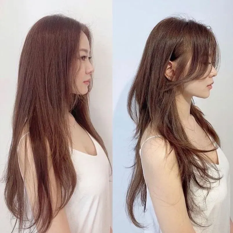 Một cô gái với mái bay layer kết hợp với tóc duỗi cúp nhẹ, tạo cảm giác dày và bồng bềnh